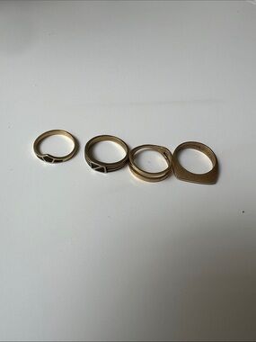 Set of 4 Gold Tone Stackable Rings with Black Enamel Accents